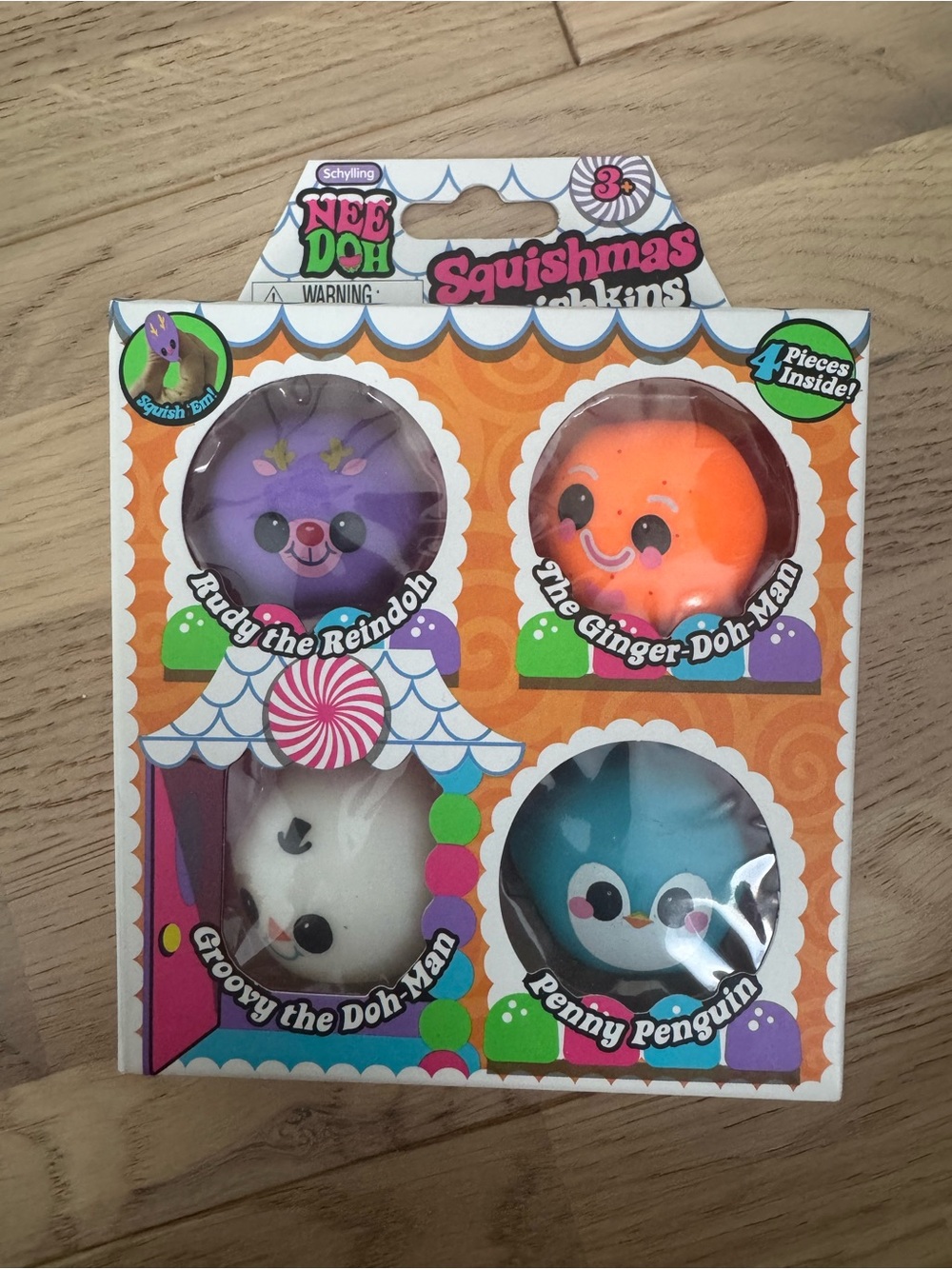 Needoh Squishmas Squishkins 4-Pack Soft Plush Toys - Purple, Orange, White, Blue